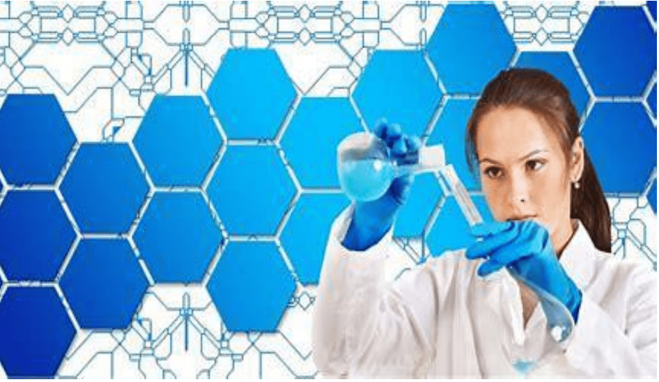 A woman in white lab coat holding a blue tube.