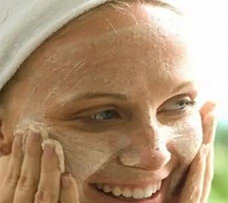 A woman with her hands on her face
